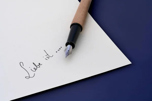 Schrijven Woord Geschreven Papier Met Pen — Stockfoto