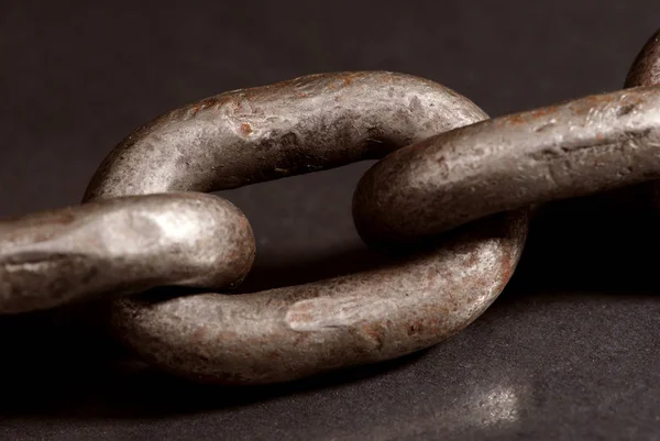 Closeup View Ancient Rusty Metal Chain Black Stone — Stock Photo, Image