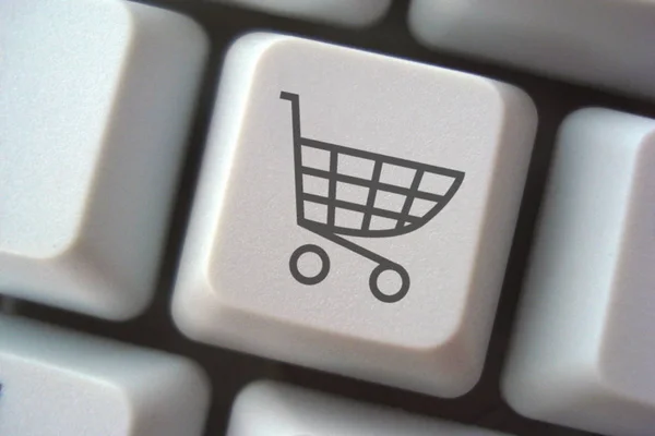 shopping cart with the word buy on computer keyboard
