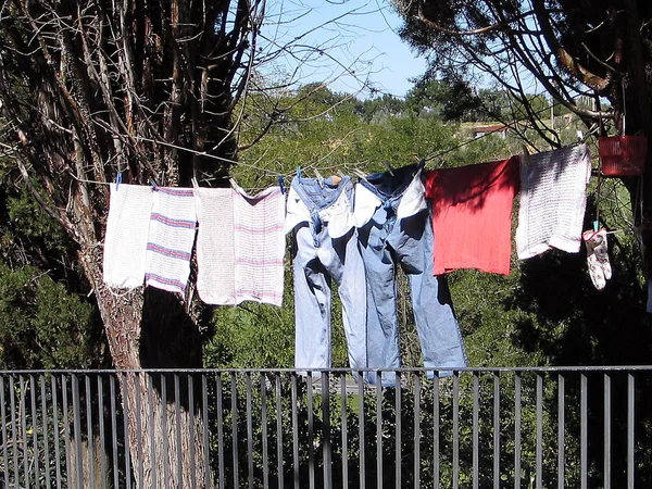 drying clothes hanging on clothesline on the street