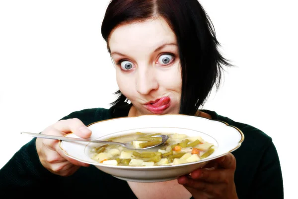 Junge Frau Isst Eine Suppe Mit Einem Löffel — Stockfoto