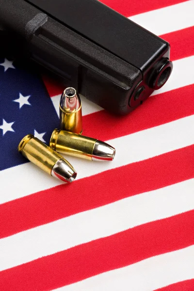 gun and bullets on flag