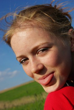 portrait of a beautiful girl in a field clipart