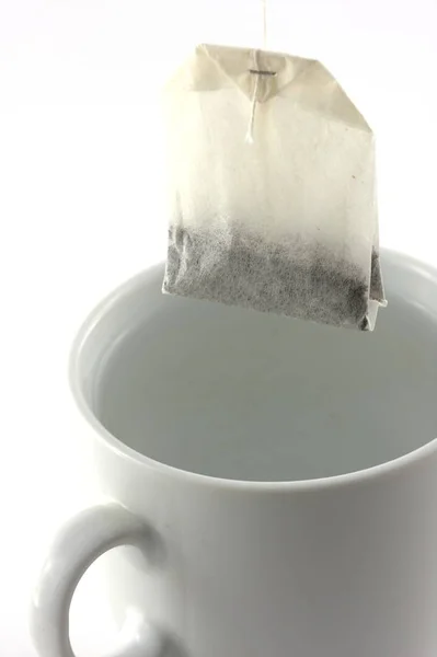 Tasse Tee Mit Zucker Auf Weißem Hintergrund — Stockfoto