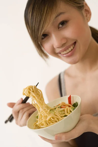 Attractive Woman Eating Noodles — Stock Photo, Image