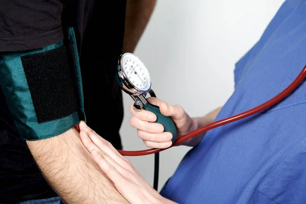 Nurse Taking Blood Pressure Stock Image