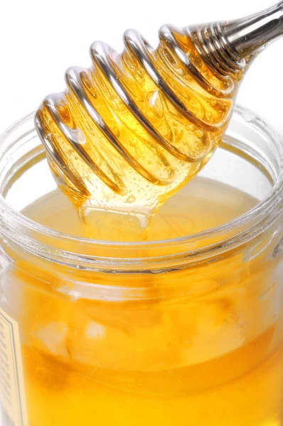 Honey Glass Scoop Stock Picture