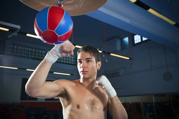 handsome young man with boxing ring