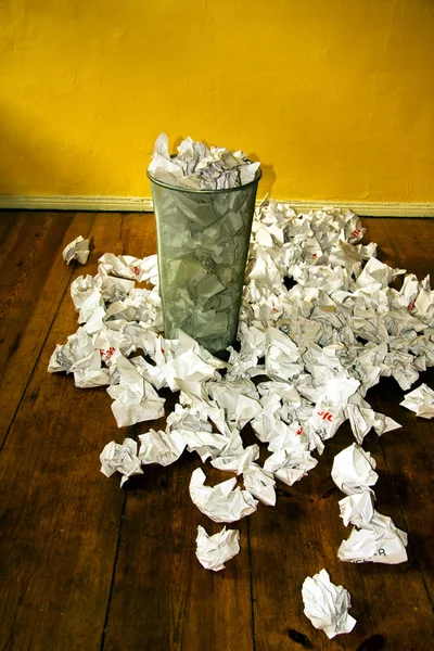 crushed paper with crumpled papers and scattered on the floor