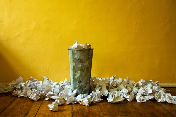 paper trash bin with crushed metal