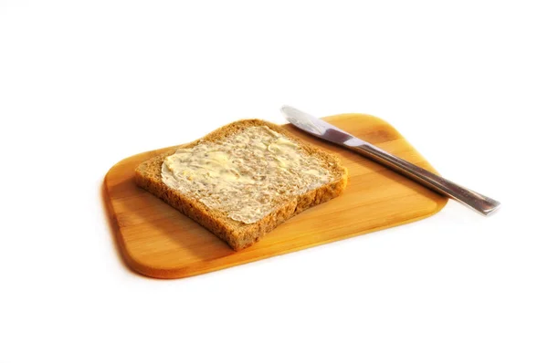 Tost Pełnoziarnisty Masłem — Zdjęcie stockowe