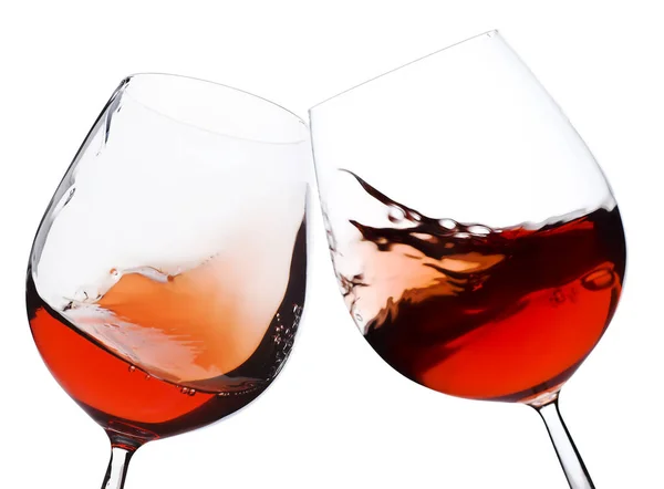 白い背景の上にワイングラスを動かすペア — ストック写真