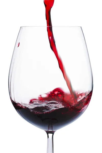 ガラスの中に赤ワインをひどく注いだ — ストック写真