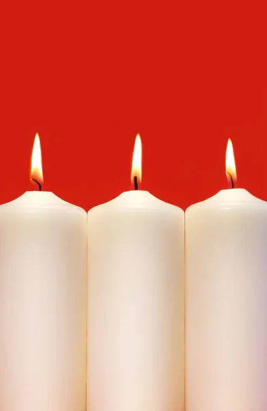 Three White Holidays Candles Red Background — Stock Photo, Image