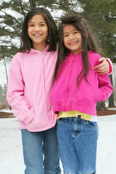 Two Sisters Enjoying Utdoors Winter Royalty Free Stock Photos