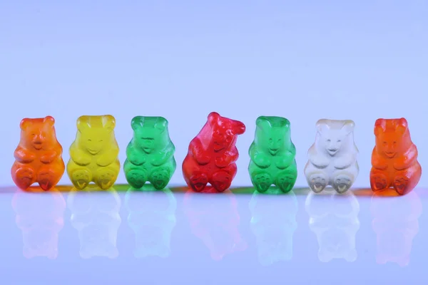 Colorful Gummy Bears Lined Rows Sole Red Bear Being Main — Stock Photo, Image