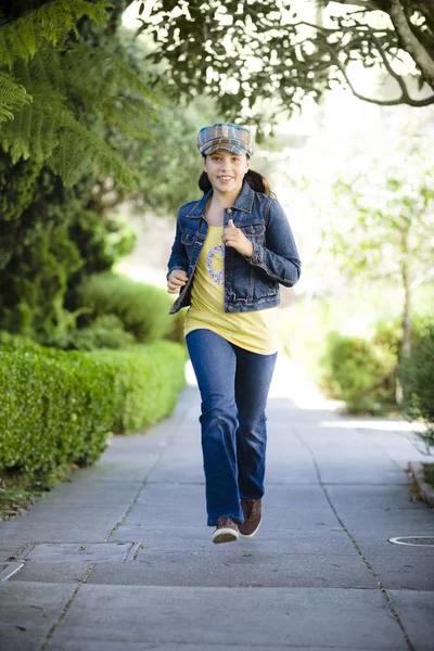 Tween Girl Running Sidewalk —  Fotos de Stock