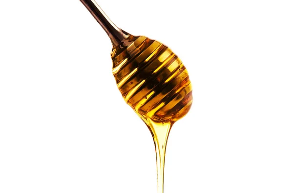 Honung Droppar Från Träsked Isolerad Vit Bakgrund — Stockfoto