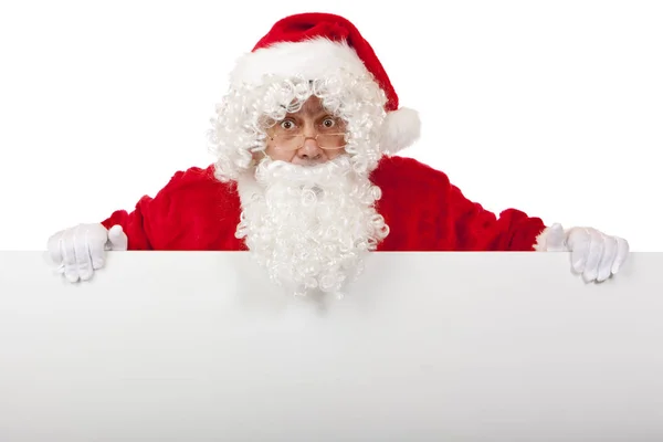 Surprised Santa Claus Holding Christmas Advertisment Board Royalty Free Stock Photos