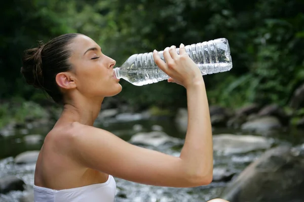 Portrait Woman Drinking Water Bottle Sitting Riverbank — Stock Photo, Image