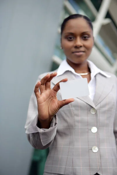 Portrait of a woman in business suit with Mtis card message