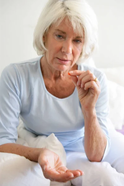 Senior Woman Sitting Sofa Drug Hand — Foto de Stock