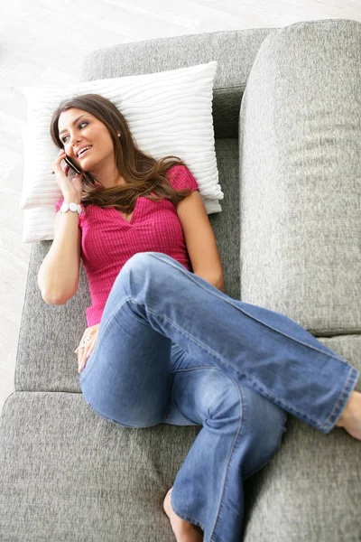 Smiling Woman Lying Sofa Mobile Phone — Stock Photo, Image