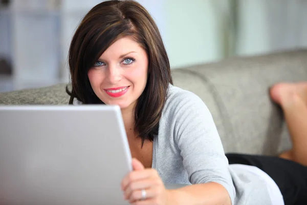 Portrait Smiling Woman Lying Sofa Front Laptop Royalty Free Stock Images