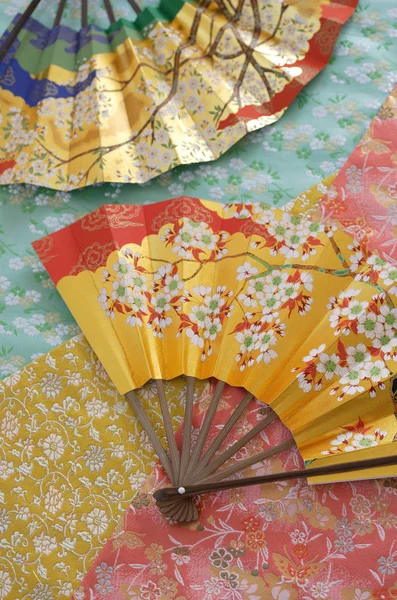 fan of japanese kimono with yellow and red flowers