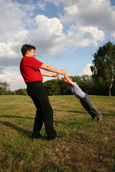 Father Rotate Son Meadow — Stock Photo, Image