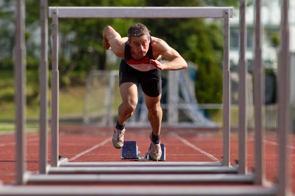 Athletic Man Running Track Stock Image