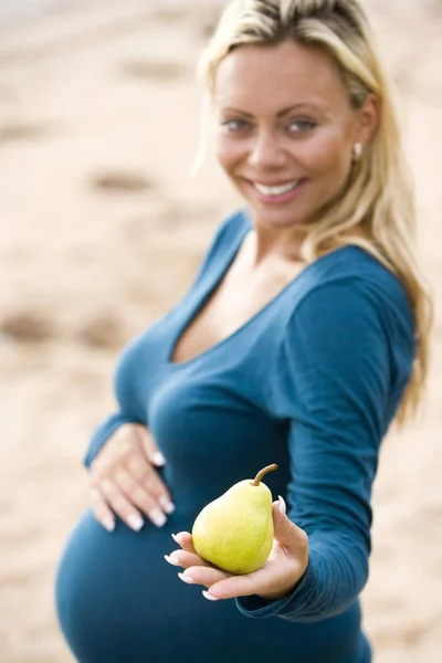 Happy Young Pregnant Woman Holding Pear — Stock Photo, Image