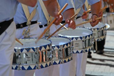 close up of men playing drums clipart