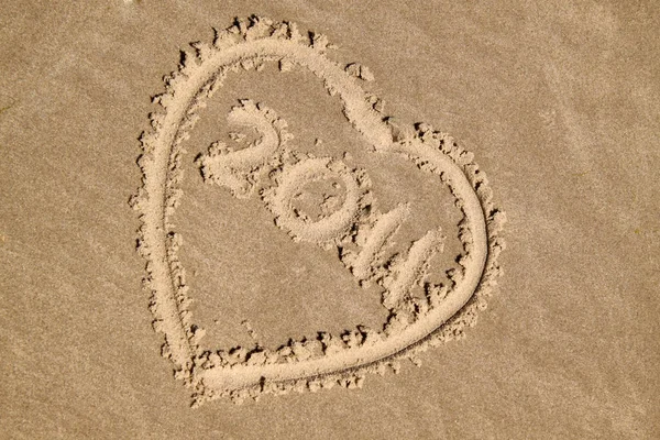 在沙滩上写下的 这个词 — 图库照片