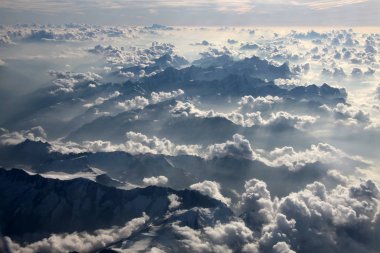 aerial view of clouds over the alps clipart