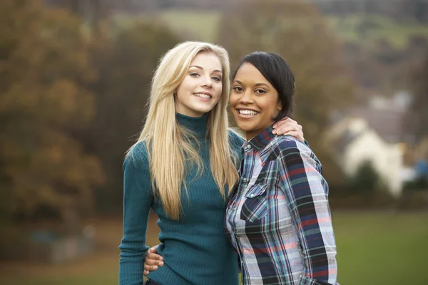 Two Female Teenage Friends Walk Autumn Landscape — Stock Photo, Image