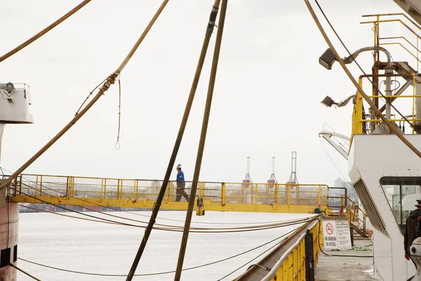 Man Blue Shirt Walks Ship Ship Yellow Gangway Horizontal Shot — Stock Photo, Image