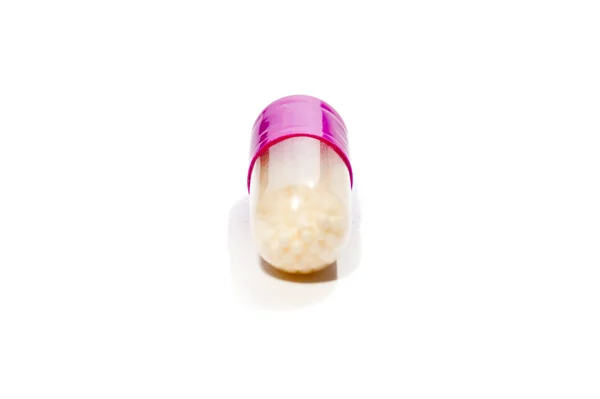 Close Purple White Capsule Containing Medication White Surface Horizontal Shot — Stock Photo, Image