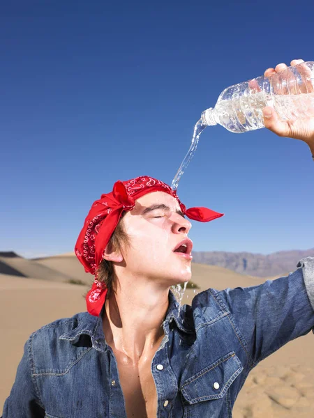 Young Man Eyes Closed Wearing Red Bandana Pouring Water Himself — Stock Photo, Image