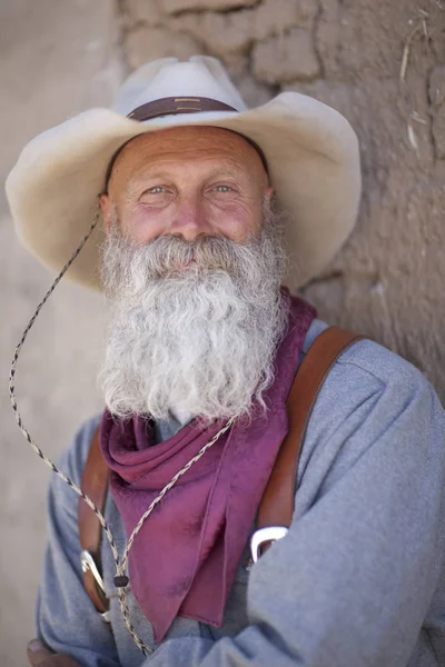 Senior Man White Beard Leaning Adobe Brick Wall Looking Camera — Stock Photo, Image