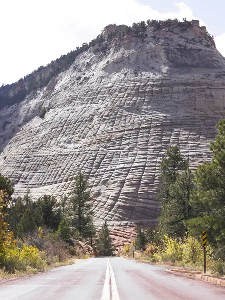 Road Leading Cliff Face Lines Rock Formation Vertical Shot Royalty Free Stock Photos