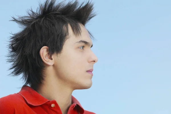 Close-up of a young man with spiky hair