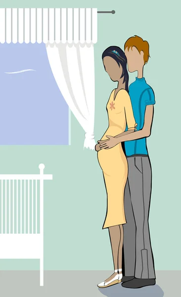 Side profile of a man embracing a pregnant woman