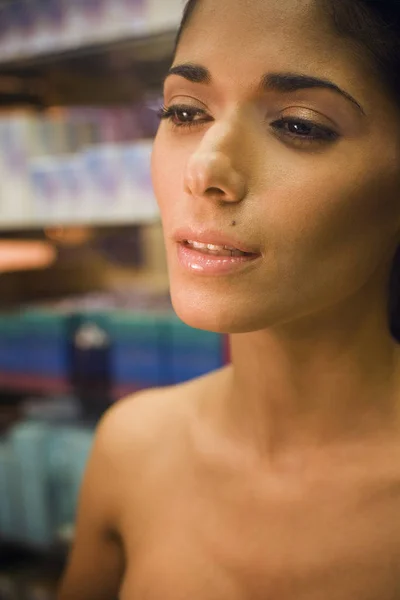 Portrait of young woman shopping in beauty supply store