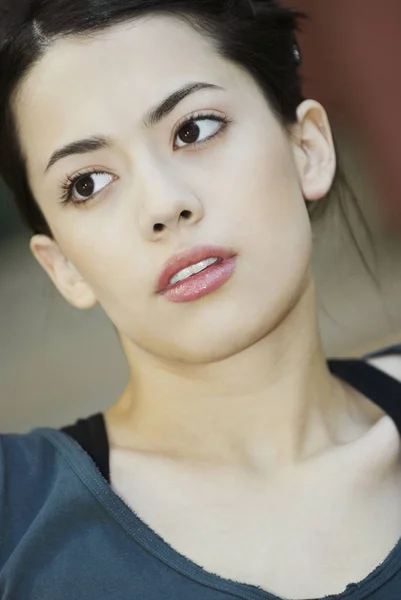 Close-up of a young woman looking sideways