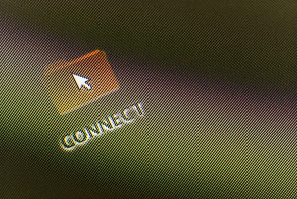 Close-up of a connect icon and a cursor on a monitor screen