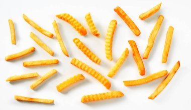 Assortment of thin, standard and crinkle cut fried potato chips, French fries or Pommes Frites arranged on white clipart