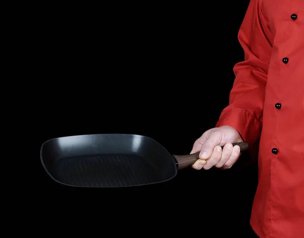 Cocinar Uniforme Rojo Sosteniendo Una Sartén Negra Cuadrada Vacía Fondo —  Fotos de Stock