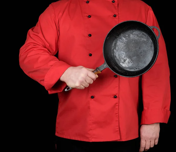 Cook Red Uniform Holding Empty Black Frying Pan Black Background — Stock Photo, Image