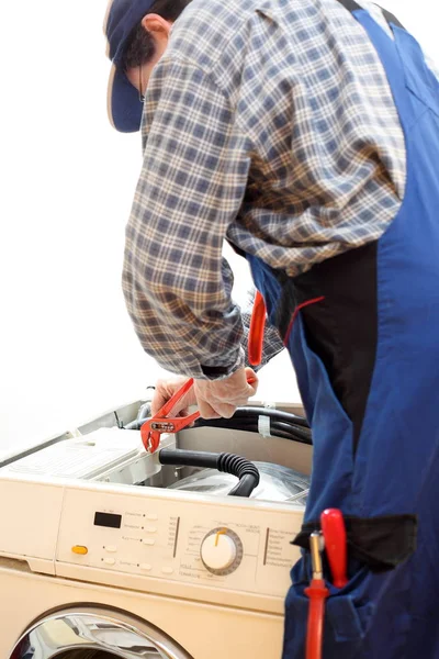 worker is repairing a machine with tools
